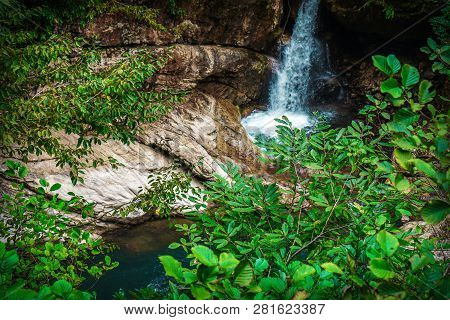 Mountain Cascade Waterfall. Eastern Abkhazia. Near The Town Of Tkvarcheli. Akarmara District.