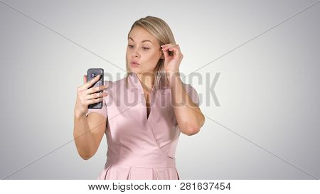 Beautiful Blond Head Lady Making Video Call Using Cell Phone On Gradient Background.