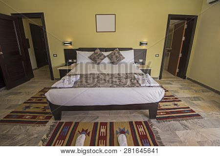 Double Bed In Suite Of A Luxury Hotel Room With En Suite Bathroom