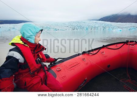 Positive Little Boy In The Boat Enjoying The View Of Fjallsarlon Glacier In Iceland, Adventure And A