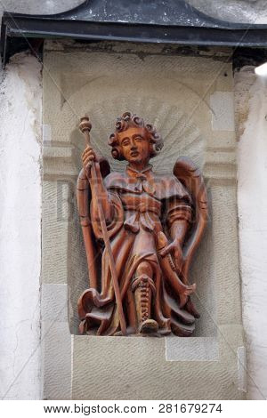 LUCERNE, SWITZERLAND - JUNE 24, 2018: Archangel Raphael statue on the building facade in Lucerne, Switzerland
