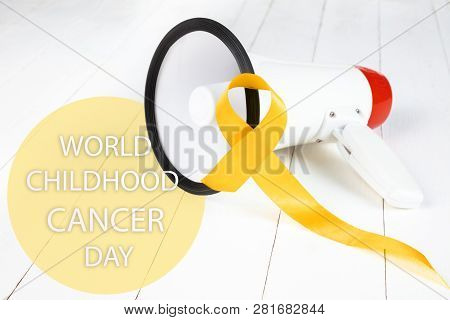 Yellow Ribbon Symbolic Color For Sarcoma Bone Cancer Awareness And Suicide Prevention On Aged Wood W