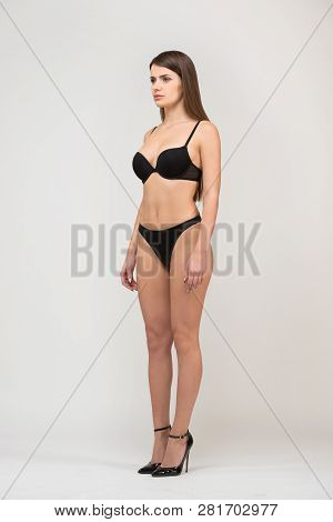 Full Length Portrait Three-quarter Of Beautiful Brunette Women With Slim Figure In Black Bra And Sho