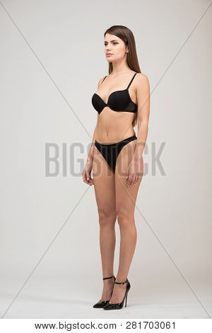 Full Length Portrait Three-quarter Of Beautiful Brunette Women With Slim Figure In Black Bra And Sho
