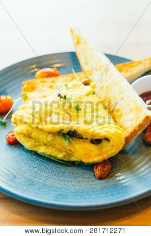 Spanich Omelet With Bread And Tomato Sauce For Breakfast