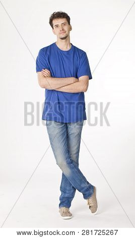 Calm Man Standing With Crossing Hands And Legs