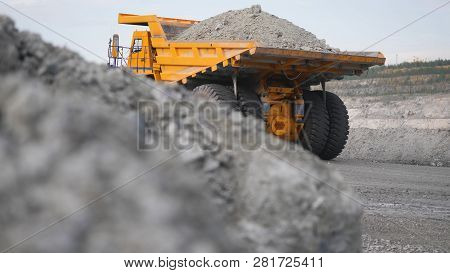 Truck Driving Career On Road. Dump Truck Carries Ore Mined In Open Pit. Heavy Large Transport In Min