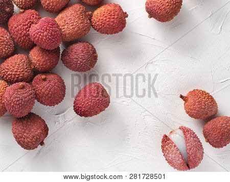 Lichee Fruit On White Textured Background. Lichee Wit Copy Space. Top View Or Flat Lay.
