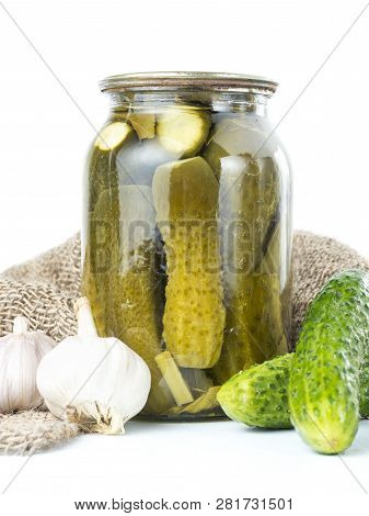 Pickled Cucumbers Isolated. Pickles In Glass Jar And Garlic Isolated On White Background. Salted Cuc