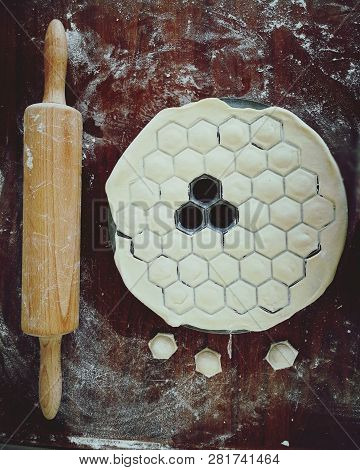 Uncooked Russian Pelmeni On Cutting Board And Ingredients For Homemade Pelmeni On White Table. Proce