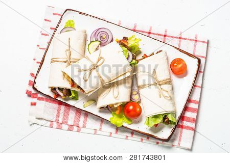 Burritos Tortilla Wraps With Beef And Vegetables On White Wooden Table.  Traditional Latin American 