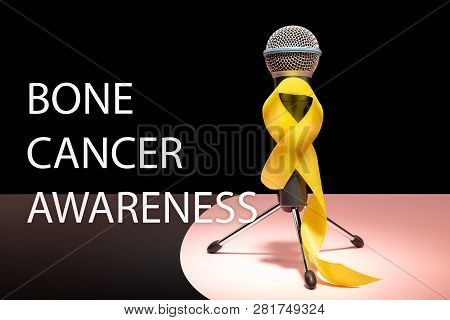 Yellow Ribbon Symbolic Color For Sarcoma Bone Cancer Awareness And Suicide Prevention With Microphon