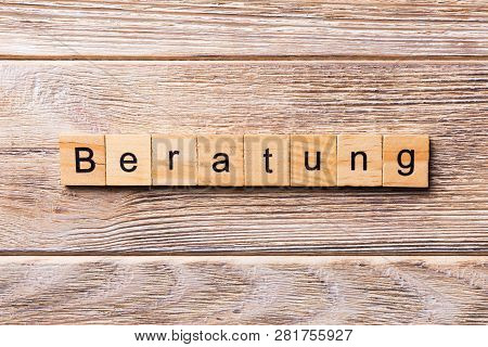 Beratung Word Written On Wood Block. Beratung Text On Wooden Table For Your Desing, Concept