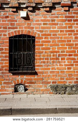 Old Eed Brick Wall With A Window