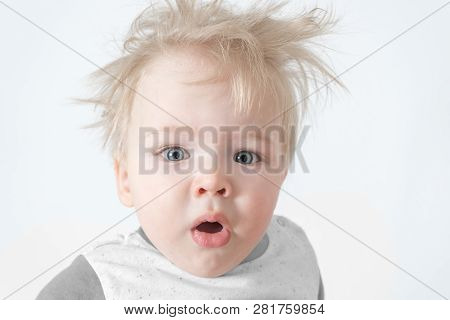 Cute Sleepy Disheveled Baby Yawns Looking At The Camera