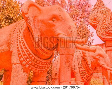 Stone Elephants, Sculptures In An Amusement Park In Coral Color. Fashion Concept