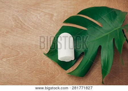 Sustainable Lifestyle. Natural Eco Crystal Deodorant Anulit On Wooden Background With Green Monstera