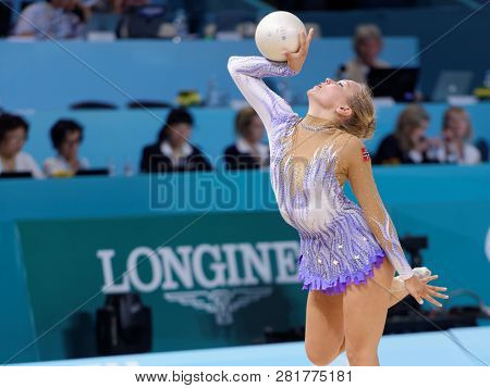 KIEV, UKRAINE - AUGUST 28, 2013: Emilie Holte, Norway performs with ball during 32nd Rhythmic Gymnastics World Championships. The event is held in Palace of Sport
