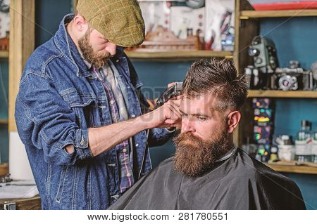 Hipster Lifestyle Concept. Hipster Client Getting Haircut. Barber With Hair Clipper Work On Hairstyl