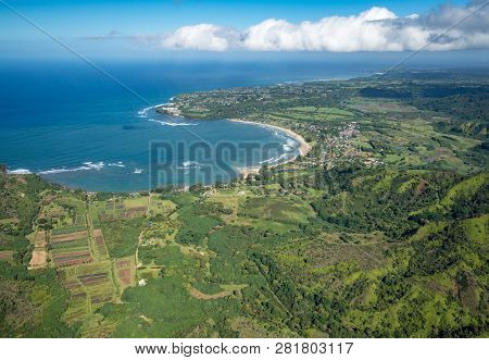 Aerial View Of Hanalei Bay And Princeville On Hawaiian Island Of Kauai From Helicopter Flight