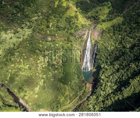 Aerial View Of Manawaiopuna Falls And Landscape Of Hawaiian Island Of Kauai From Helicopter Flight
