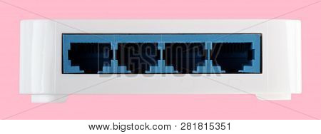 White 8 Port Plastic Ethernet Switch Isolated On Pink Background At Dry Day