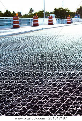 Bridge Metal Planks That Open With Orange And White Done Barricades Place For Traffic For Contructio
