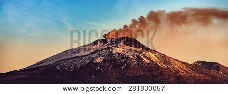 The Mount Etna Volcano With Smoke At Dawn In Winter. Catania, Sicily Island, Italy, Europe