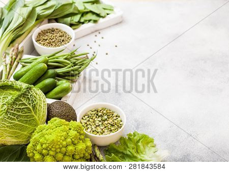 Assorted Green Toned Raw Organic Vegetables On White Background. Avocado, Cabbage, Broccoli, Caulifl