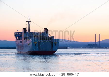 Piombino (li), Italy - August 09, 2016: Mv Marmorica Approaching The Port Of Piombino At Sunrise