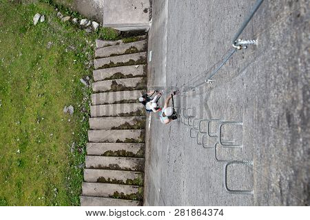 Finkenberg, Austria - June 9, 2018: Group Of Alpinists Climbing The Via Ferrata On The Schlegeis Dam