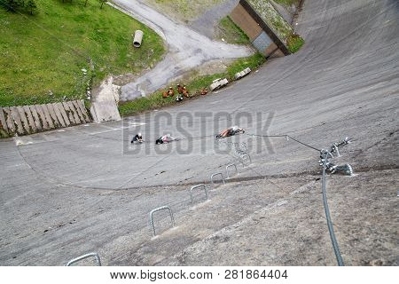 Finkenberg, Austria - June 9, 2018: Group Of Alpinists Climbing The Via Ferrata On The Schlegeis Dam