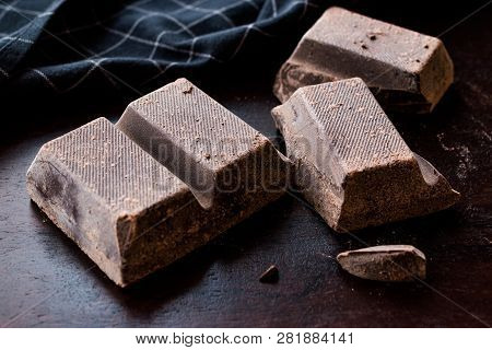 Couverture Bitter Chocolate Pieces On Dark Wooden Surface.