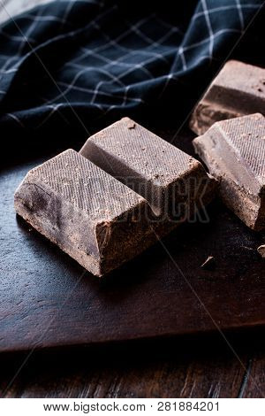 Couverture Bitter Chocolate Pieces On Dark Wooden Surface.