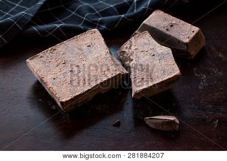 Couverture Bitter Chocolate Pieces On Dark Wooden Surface.