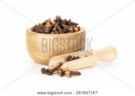 Lot Of Whole Small Dried Cloves Spice Scoop With Wooden Bowl Isolated On White Background