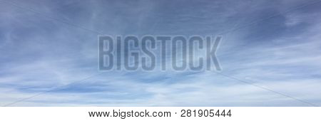 Beautiful Snowy Clouds Against A Blue Sky Background. Sky Cloud. Blue Sky With Winter Clouds Weather