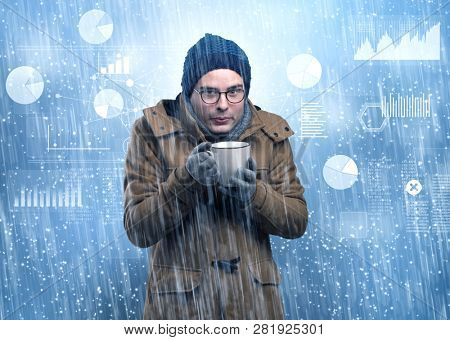 Young businessman shivering with graphs, reports and chart concept