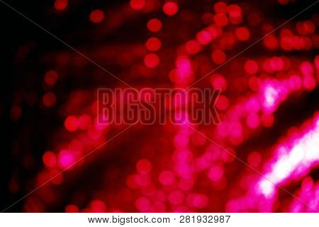 Out of focus Sequin Background. room for text. Red Sequin shallow depth of focus background.