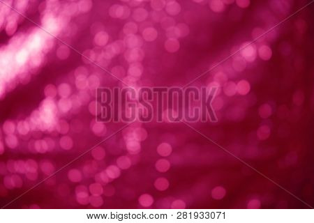 Out of focus Sequin Background. room for text. Fuchsia Pink Sequin shallow depth of focus background.