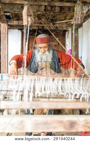 Kullu, Himachal Pradesh, India - August 09, 2018 : Himachali Pattu Saree Weaver On His Loom, Handloo