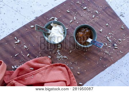A Healthy Breakfast With Homemade Bread, Spreadable Cheese And Pumpkin Jam.