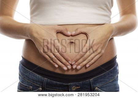 Body Care, Pregnancy Diet Concept, Female Hands Forming A Heart Shape On The Abdomen, Isolated On Wh