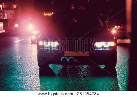 Night View Of The Cars. Road In The City At The Night With Yellow And Red Electrical Light For Cars 