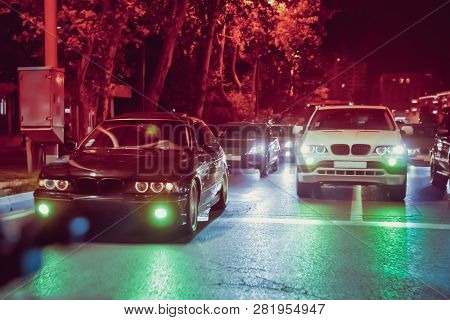Night View Of The Cars. Road In The City At The Night With Yellow And Red Electrical Light For Cars 