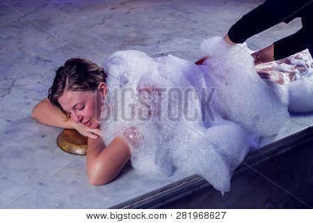 Young Woman In Red Bikini Relaxing In Hammam Or Turkish Bath.