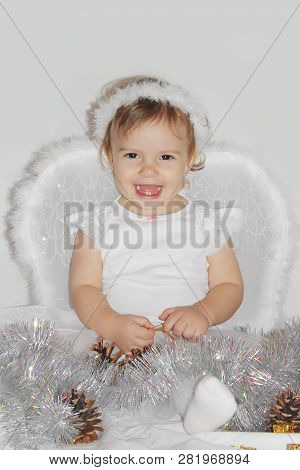 Little Child In The Costume Of An Angel. Selective Focus.