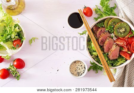 Poke Bowl. Buddha Bowl. Traditional Salad With Pieces Of Medium-rare Grilled Ahi Tuna And Sesame Wit