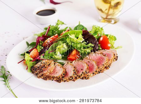 Japanese Traditional Salad With Pieces Of Medium-rare Grilled Ahi Tuna And Sesame With Fresh Vegetab
