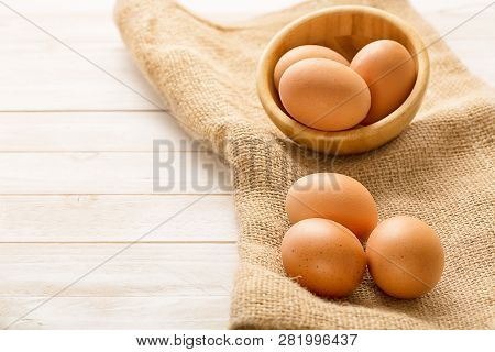 Bowl With Egs On White Wooden Background